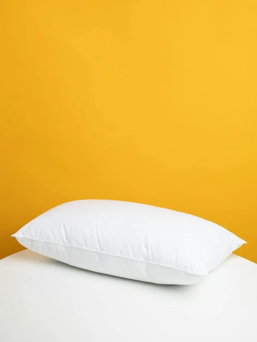 Stack of soft pillows on a bed